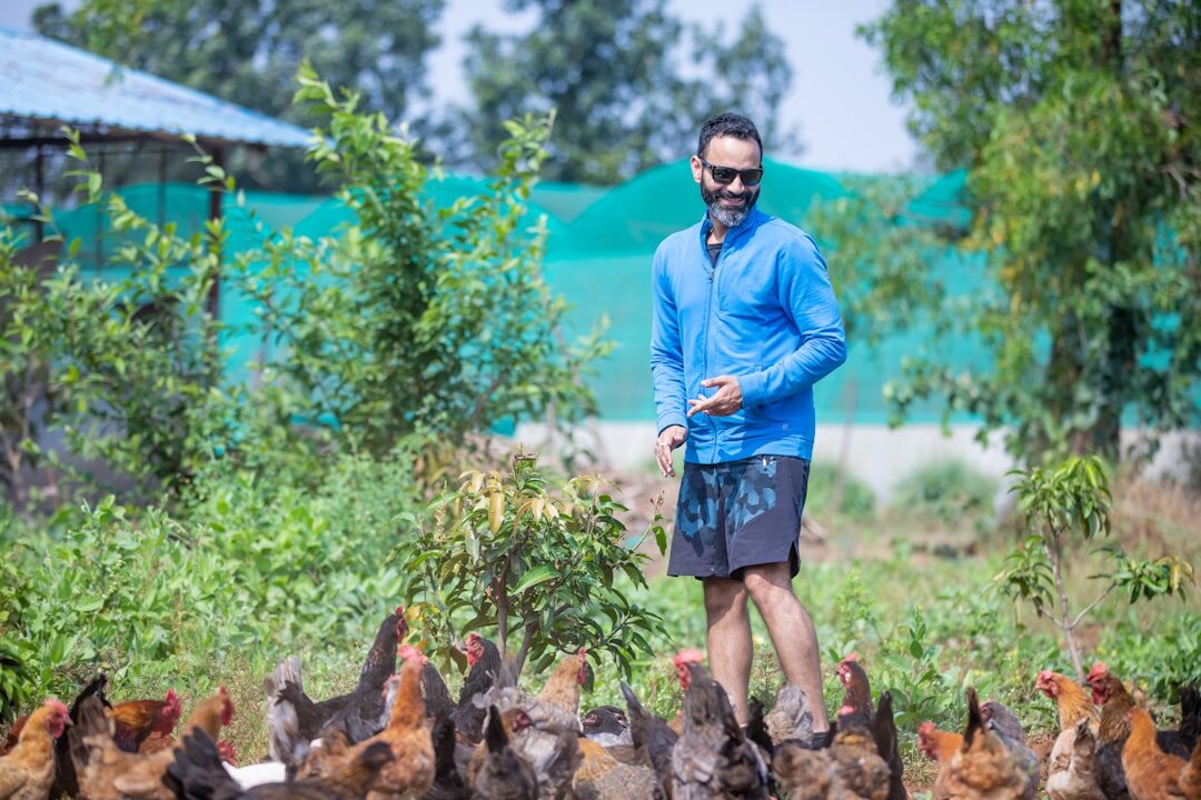 woman in garden with chickens