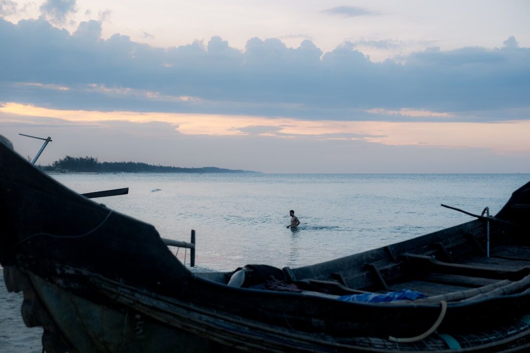 fisherman preparing boat at dawn